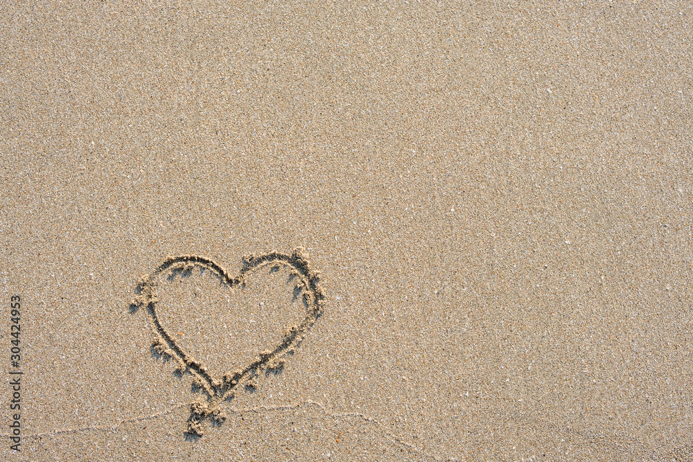Sand surface and heart shape