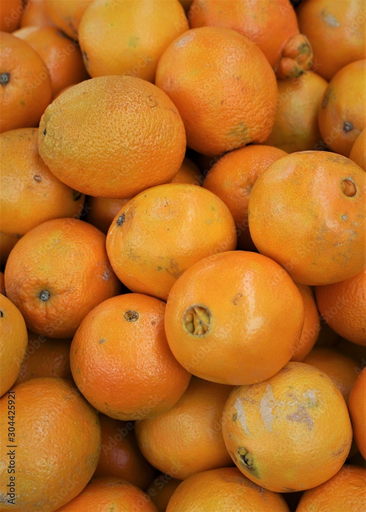 closeup of oranges on display at the market closeup of oranges on display at the market