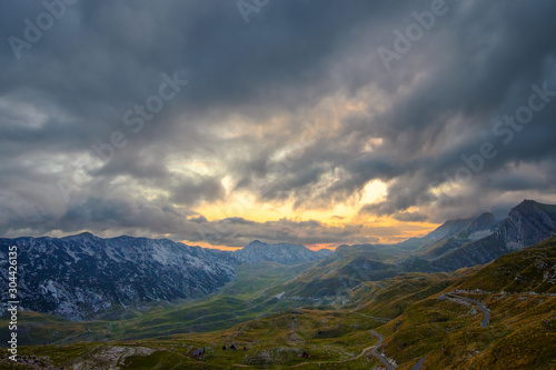 Summer sunset mountaine landscape with cloudy sky. Mountain scenery, National park Durmitor, Zabljak, Montenegro.