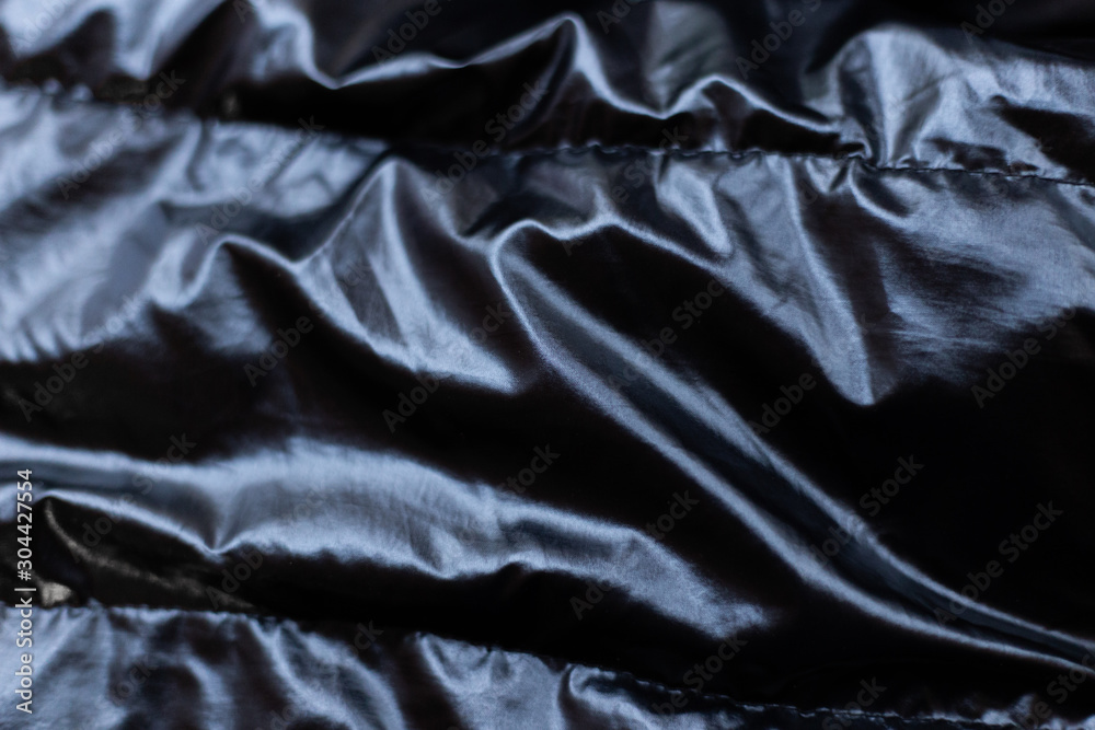 Closeup of crumpled black silk fabric copy space Closeup of crumpled black silk fabric copy space