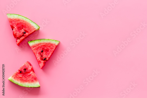 Cut watermelon for break with fruit on pink background top view mockup