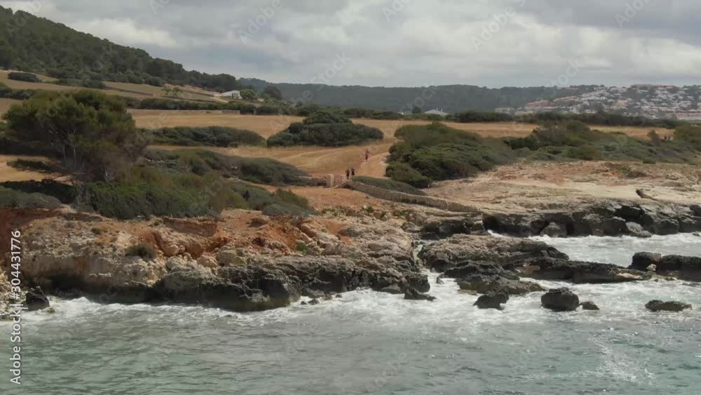 Gorgeous Beach Trail In Santo Tomas Beach With A Beautiful View Of Wide Land And Big Grass - Aerial Shot Gorgeous Beach Trail In Santo Tomas Beach With A Beautiful View Of Wide Land And Big Grass - Aerial Shot