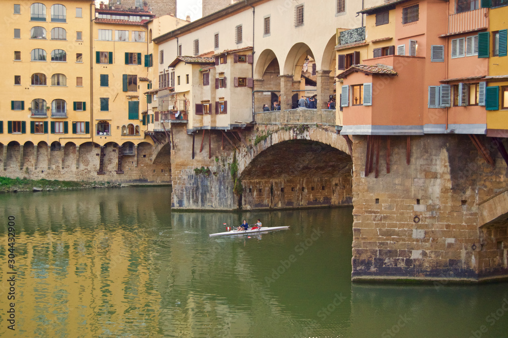 rowing under ponte vecchio