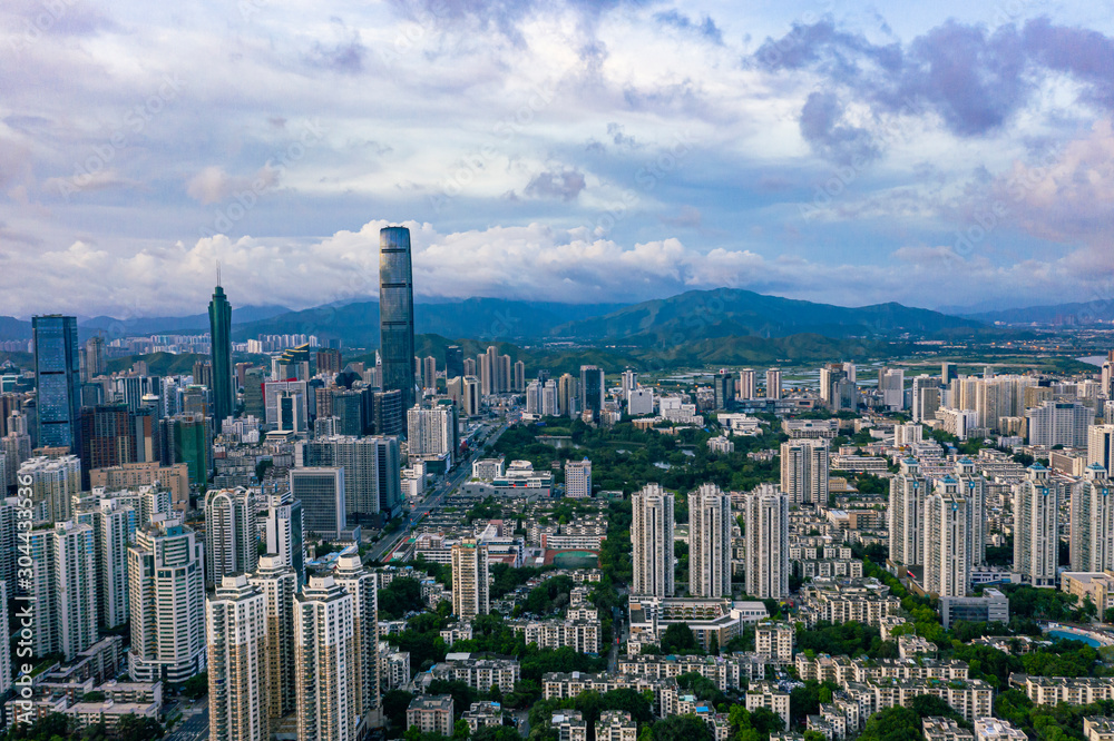 Fototapeta premium an aerial view of summer sunrise in shenzhen china, with hills in hong kong at the background