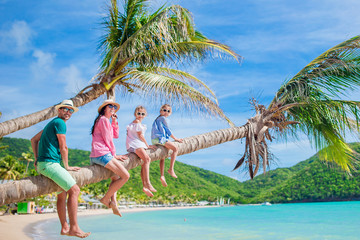 Young family on vacation have a lot of fun on palmtree