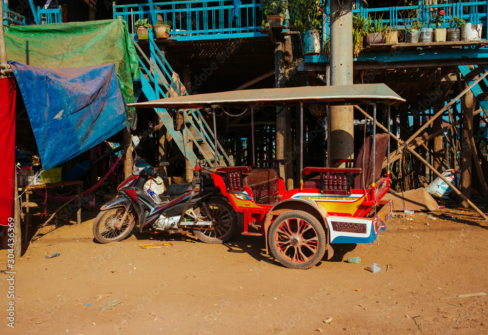 Fototapeta premium Tuk-Tuk Taxi, Old broken and rusty Car in summer Asia