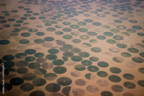 Circular fields are a popular form of irrigation and land use in deserts. Ecological disaster.