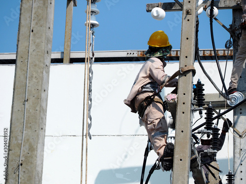 Fototapeta Naklejka Na Ścianę i Meble -  electrician man working at height and dangerous ,high voltage power line maintenance