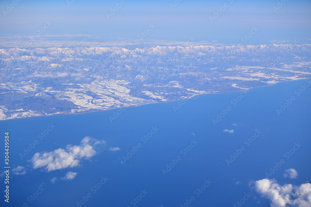 Bird view of snow and sea