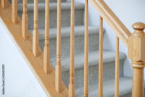 Canvas wooden stairs. Stair handrail closeup. - Image