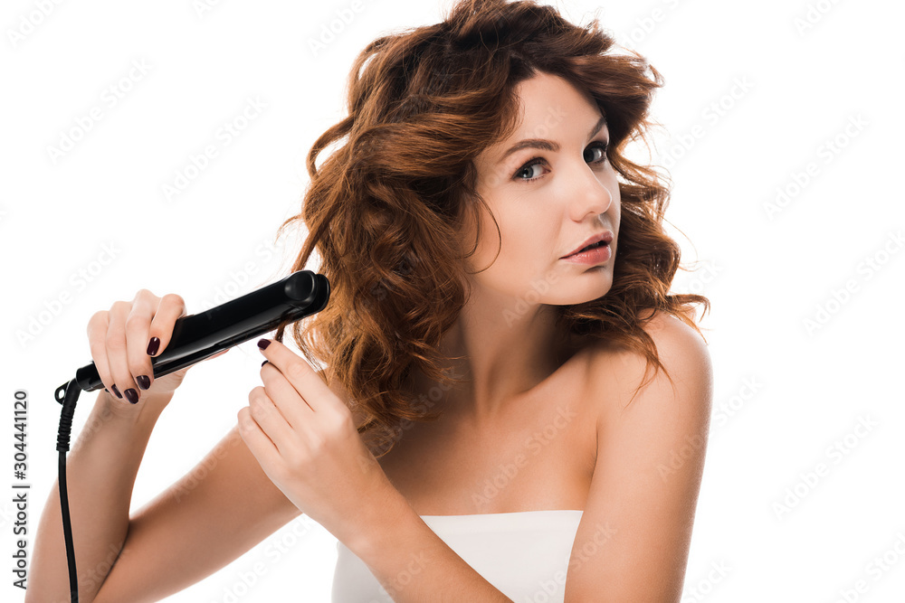 beautiful curly woman using hair straightener isolated on white beautiful curly woman using hair straightener isolated on white