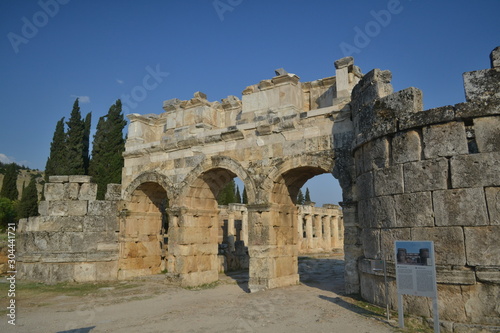 Old Hierapolis ruins, amphitheatre and touristic locations captured with hill background, in daytime.