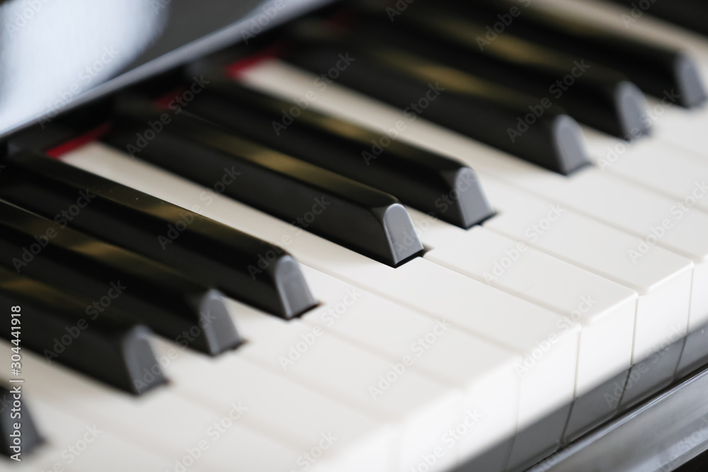 Close-up of piano keys in white and black - Image
