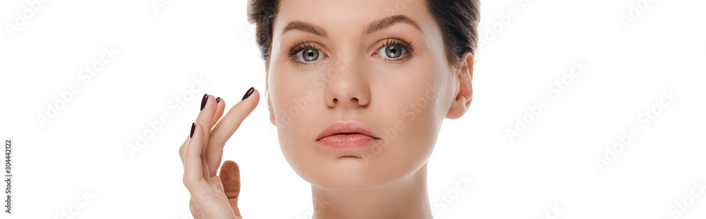 panoramic shot of attractive woman looking at camera isolated on white