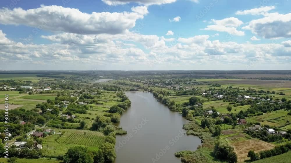 Panoramic video from drone above countryside in a summer cloudy day. Panoramic video from drone above countryside in a summer cloudy day.