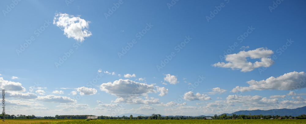 The white clouds have a strange shape and moutains,blue sky The white clouds have a strange shape and moutains,blue sky