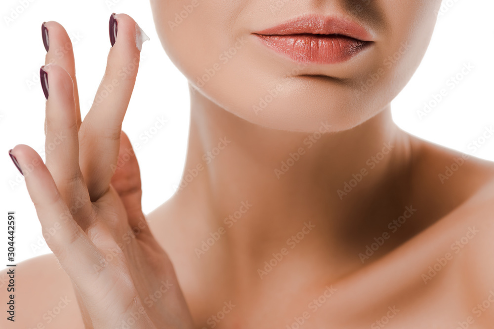 cropped view of naked woman with face cream on finger isolated on white cropped view of naked woman with face cream on finger isolated on white