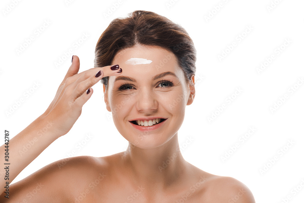 happy naked girl applying face cream isolated on white happy naked girl applying face cream isolated on white