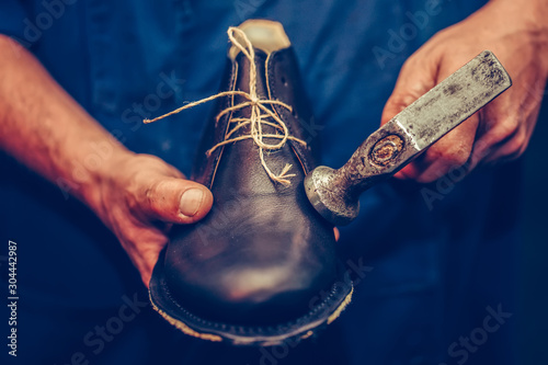 Shoemaker making comfortable hand made shoes for people