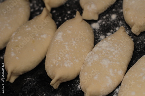 raw pies in flour for frying