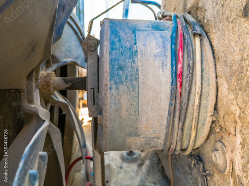 closeup of old dusty and rusty fan and it's motor of window air condition 