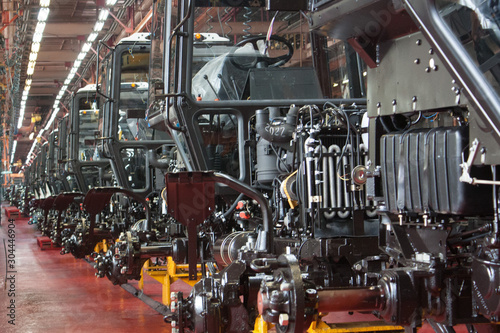 Tractor Manufacture Assembly Line Inside The Agricultural Machinery Factory.