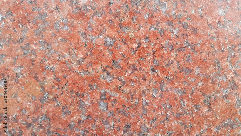 Closeup texture of red concrete floor. Background of a red concrete in sunshine Closeup texture of red concrete floor. Background of a red concrete in sunshine