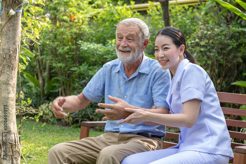 Young nurse take care senior man at home, Senior man happniess and smiling with nurse, Health care concept Young nurse take care senior man at home, Senior man happniess and smiling with nurse, Health care concept