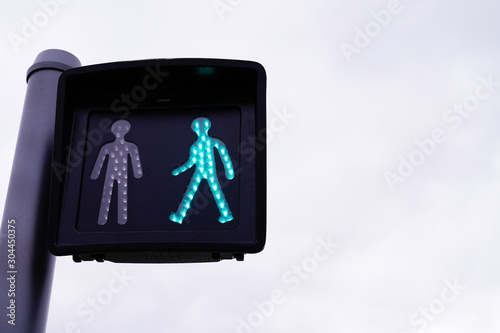 green traffic light signaling pedestrian crossing
