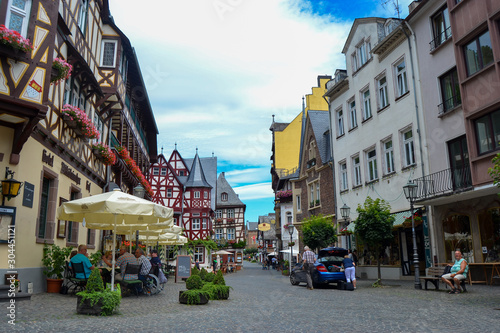 human activity in a small typical old village in germany in a summer day