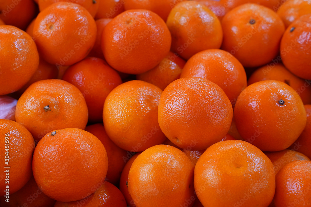 A lot of orange mandarin as a background A lot of orange mandarin as a background
