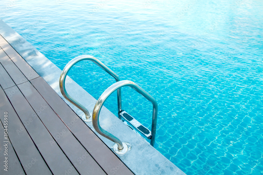 swimming pool with wooden floor and stair,in the hotel swimming pool with wooden floor and stair,in the hotel