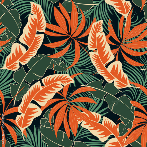 Trend seamless tropical pattern with bright orange and green plants and leaves on a dark background. Summer colorful hawaiian seamless pattern with tropical plants. Vintage pattern.