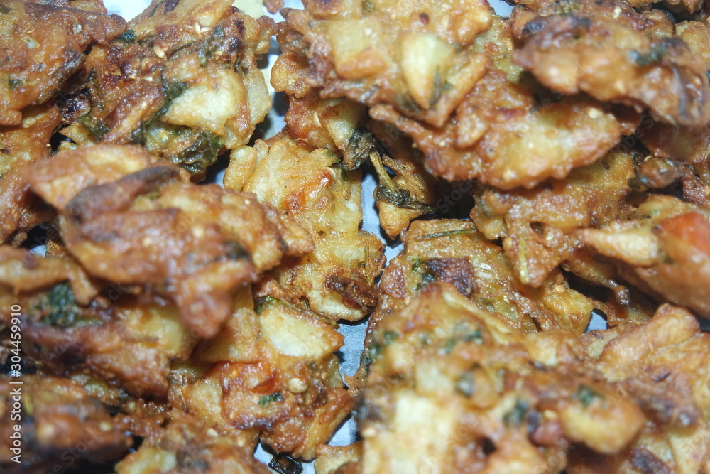 close-up view with selective focus of crispy basin pakora/pakoda or patties close-up view with selective focus of crispy basin pakora/pakoda or patties