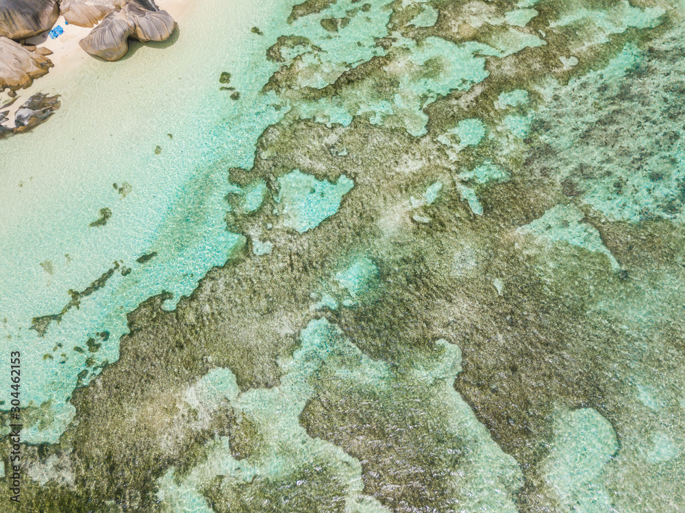 Fototapeta premium anse source d'argent beach by drone in seychelles