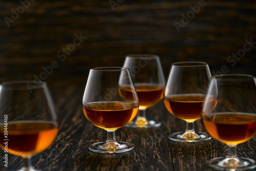 glasses of  congac on a black background, selective focus.