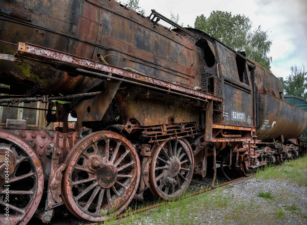 dilapidated, rusty and abandoned steam locomotive