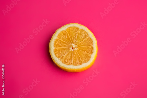  half lemon on pink background