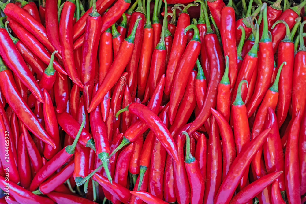 Texture of fresh Red pepper. A lot of spicy collected. Fresh Chilli close-up. Background of Chilli pepper Texture of fresh Red pepper. A lot of spicy collected. Fresh Chilli close-up. Background of Chilli pepper
