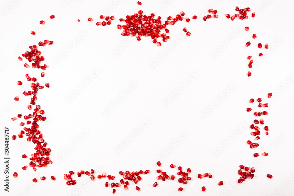 Pomegranate seeds isolated on white.