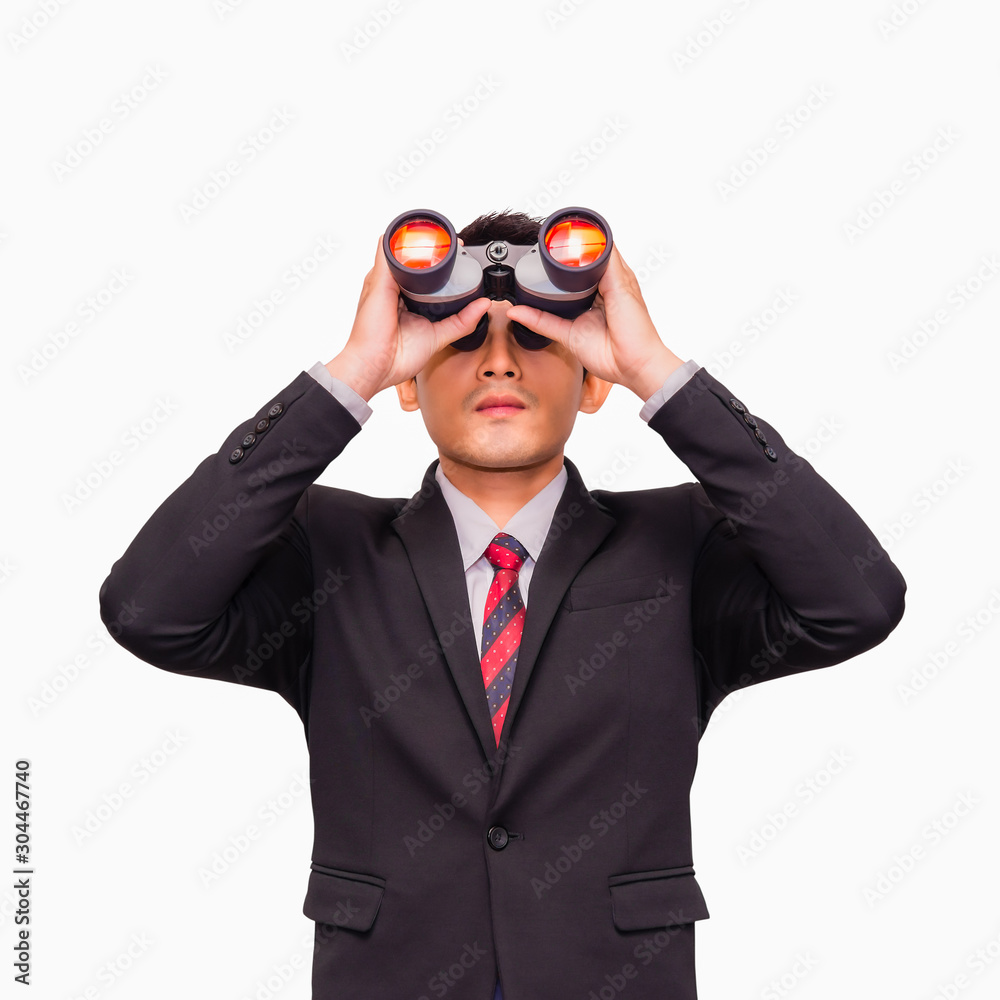 Asian young businessman standing and looking through binoculars Asian young businessman standing and looking through binoculars