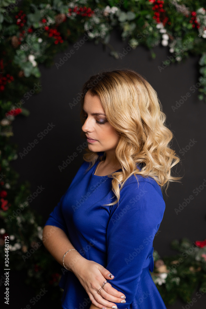 Beautiful woman with in a New Year s interior. Christmas Eve. Beautiful woman with in a New Year s interior. Christmas Eve.