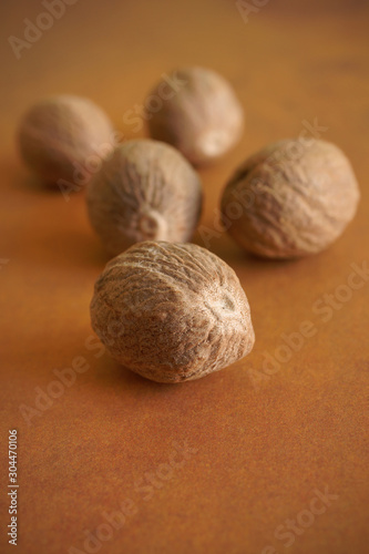 Whole and ground nutmeg a fragrant spice from the fruit of tree Myristica fragrans