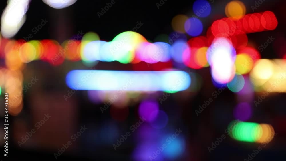 Colorful blinking defocused carnival lights at night