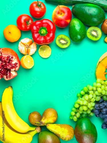 Fruits and vegetables rich in antioxidants  vitamin and fiber on blue background. Flat lay style  selective focus