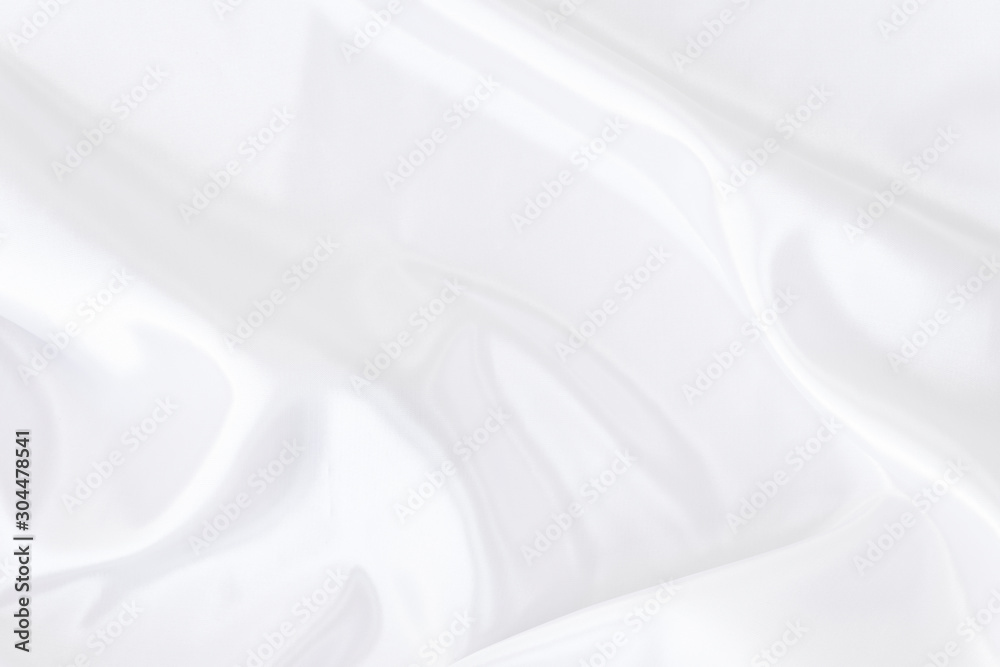 White gray satin texture that is white silver fabric silk background with beautiful soft blur pattern natural.