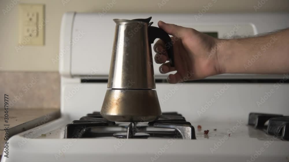 Hand Removed Coffee Pot from Dirty Stovetop 60fps