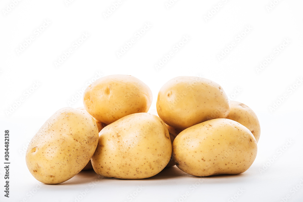 organic raw potatoes on white background organic raw potatoes on white background