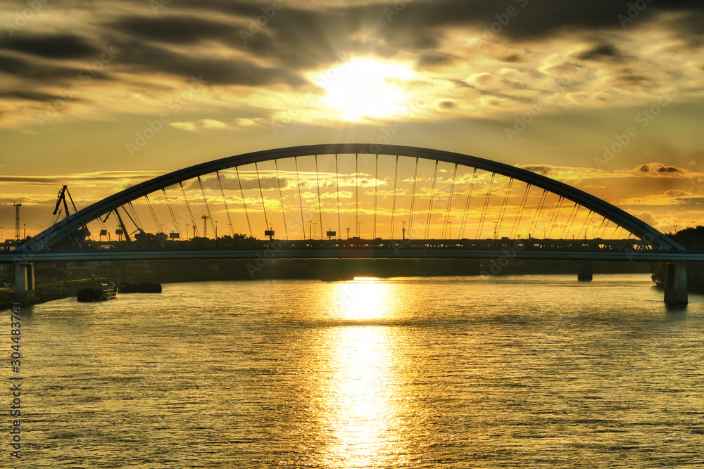 Sunrise in Bratislava over Apolo bridge and Danube river, Slovakia