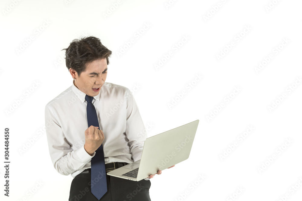 Portrait of smart young asian businessman wearing white shirt holding and looking to computer laptop clench one's fists and emotion glad on isolated white background and copy space. Portrait of smart young asian businessman wearing white shirt holding and looking to computer laptop clench one's fists and emotion glad on isolated white background and copy space.